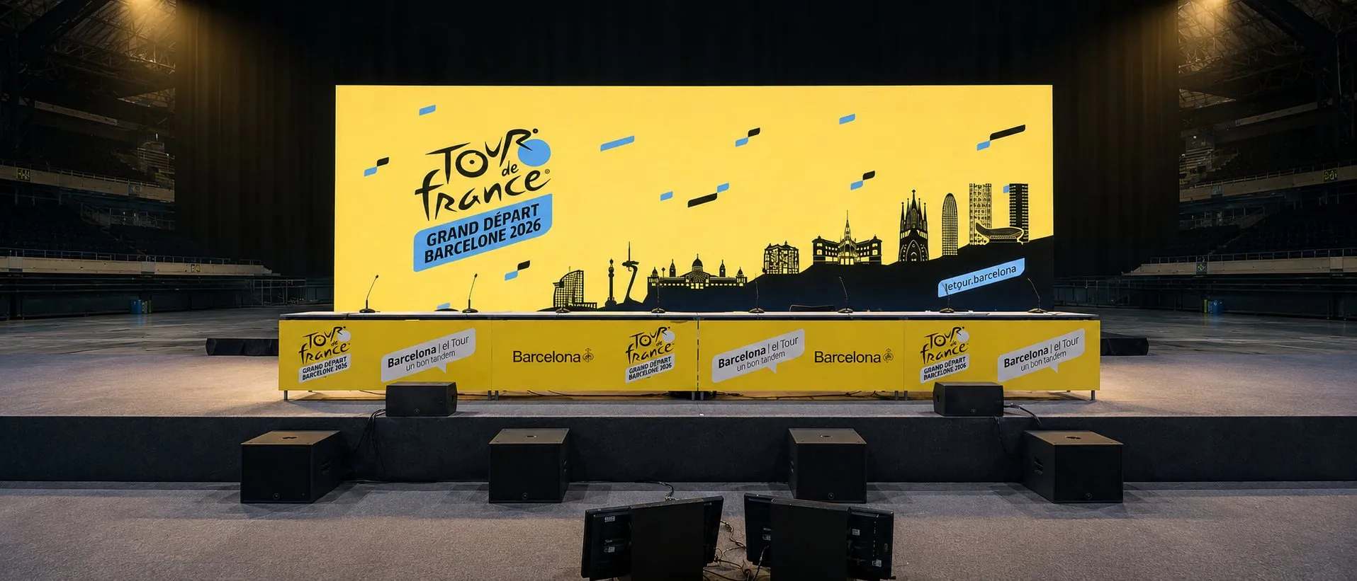 Pantalla LED de gran formato con la gráfica oficial del Grand Départ Tour de France Barcelona 2026 en el Palau Sant Jordi